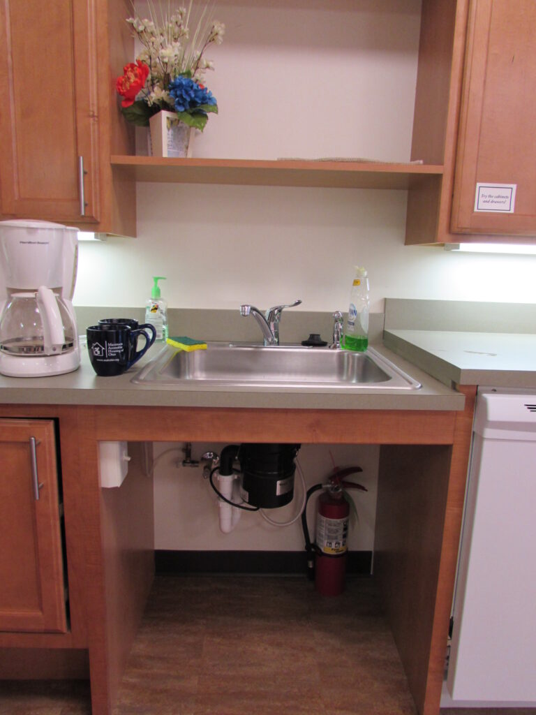 Picture of sink when open underneath - lever sink handle.