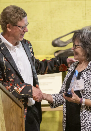 Steve Hansler presenting the award to Jan Hollinger Jones at the 2019 Birthday Bash.